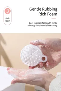 Detail view of silicone scalp massage brush creating rich lather with soft bristles