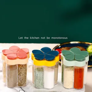 Five-compartment flower-shaped spice jars for kitchen seasoning storage.