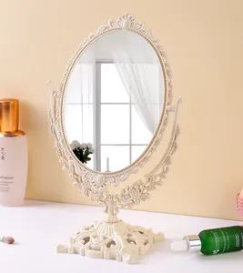 Specchio da trucco vintage in stile europeo con cornice ovale elegantemente intagliata