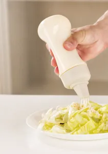 Detail of five-hole nozzle on flexible squeeze sauce bottle for easy dispensing