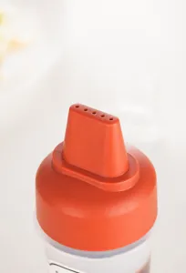 Close-up of 5-hole squeeze bottle nozzle for precise and controlled sauce dispensing