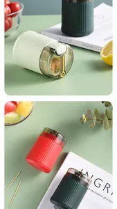 Close-up of modern automatic press-type toothpick dispensers in various colors