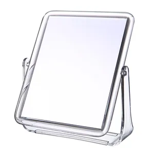 Transparent double-sided rotating desktop makeup mirror with a clear acrylic stand