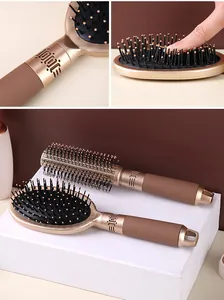 Detail showing the flexible gold-toned air cushion and ergonomic matte handle texture