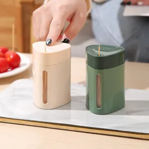 Modern automatic press-type toothpick dispenser set in cream and dark green colors