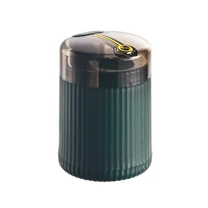 Modern dark green ribbed automatic toothpick box dispenser with gold press button