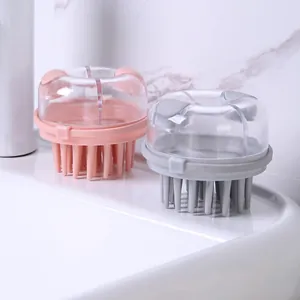Dual-compartment scalp massage brush with transparent lid for shampoo dispensing