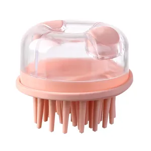 Pink silicone scalp massager brush with transparent dispensing lid for hair washing