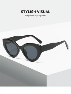 Minimalist black cat-eye sunglasses with gray lenses for women's stylish daily wear.