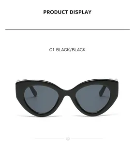 Classic black cat-eye sunglasses for women with dark lenses and a trendy thick frame