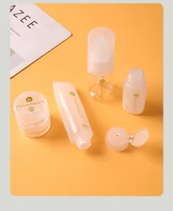 Set of portable travel cosmetic bottles including squeeze tube and pump dispenser