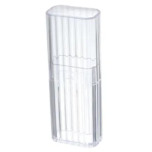 Portable clear ribbed plastic storage box for cotton swabs and jewelry on white background