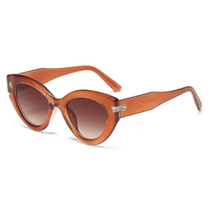 Trendy women's cat-eye sunglasses with concave jelly brown frames and gradient lenses