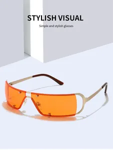 Lunettes de soleil Y2K cyberpunk avec verres orange sans monture et branches dorées