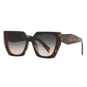 Oversized geometric cat-eye sunglasses with tortoiseshell frame and UV400 protection