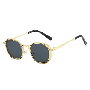 Lunettes de soleil hexagonales dorées tendance pour femmes avec verres teintés noirs