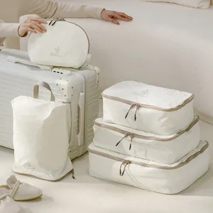 Premium cream 5-piece Taslon travel packing cubes set for organized luggage storage