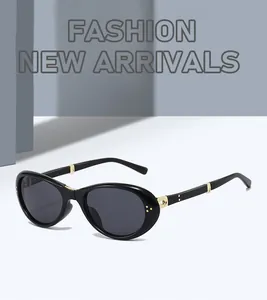 Detailed macro view of stylish black foldable sunglasses with elegant gold metal accents