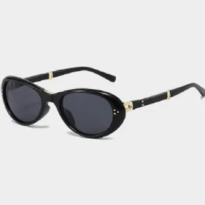 Detailed view of black foldable oval sunglasses with elegant gold metal hinges