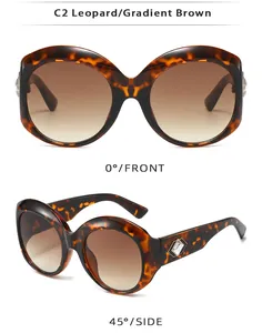 Oversized round leopard print sunglasses with gradient brown lenses shown from two perspectives.