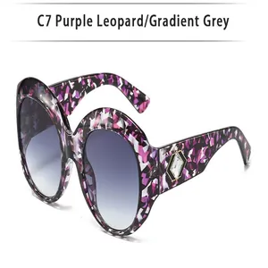 Oversized round sunglasses featuring purple leopard frame and gradient grey lenses