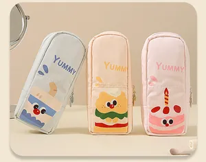 Set of three cute cartoon makeup brush storage bags in blue, beige, and pink pastel colors