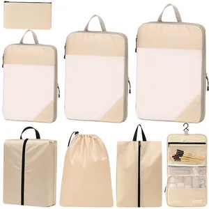 8-piece beige travel packing cube set with mesh laundry bags and hanging toiletry pouch