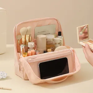 Large capacity pink makeup travel bag with multiple compartments for cosmetics storage