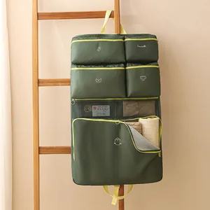 Green multi-compartment hanging travel organizer bag for clothing and underwear storage