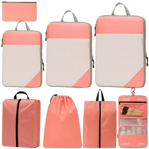 Complete 7-piece coral pink travel packing cubes and hanging toiletry organizer set