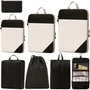 7-piece black and white compression travel packing cube and hanging toiletry bag set