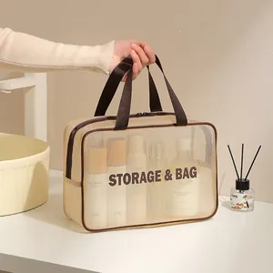 Trousse de toilette en filet beige imperméable pour cosmétiques et soins de voyage