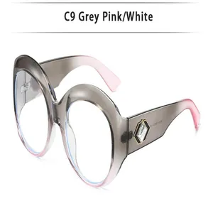 Detailed side view of oversized round glasses with grey and pink gradient frames