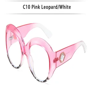 Oversized round sunglasses with pink to white gradient frames and rhinestone accents