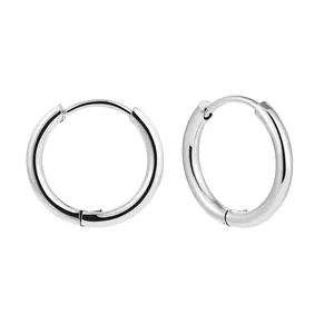 Close-up of polished stainless steel hoop earrings with a sleek minimalist design
