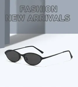 Detailed macro shot of vintage 90s narrow cat-eye sunglasses with matte black frames