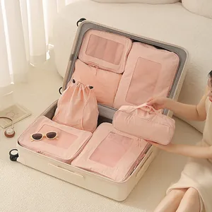 7-piece pink Taslan travel luggage organizer bag set in suitcase for clothes storage