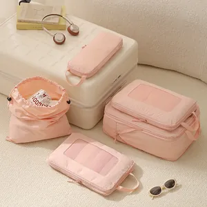 Set of pink compression travel packing cubes with mesh panels for efficient luggage organization