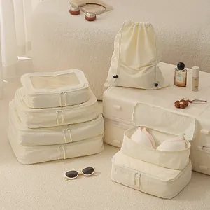 7-piece premium cream-colored Taslon travel packing cube set for organized suitcase packing