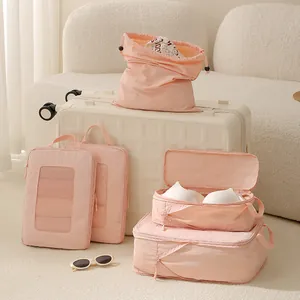 Premium pink Taslon mesh compression travel packing cube set organized on suitcase