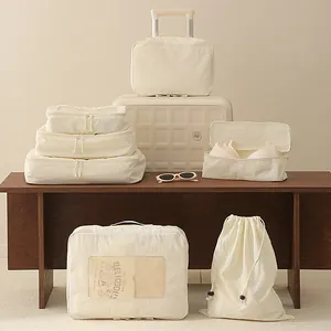 7-piece cream Taslon travel packing cubes for organized luggage suitcase storage