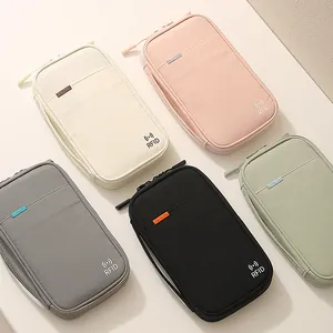 Taslan waterproof multi-functional passport bags in five colors for travel organization.