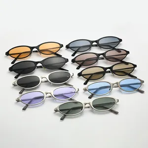 Set of vintage 90s cat-eye sunglasses with colorful lenses and stylish narrow metal frames