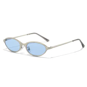 Stylish vintage 90s cat-eye sunglasses featuring a narrow metallic frame and blue lenses.