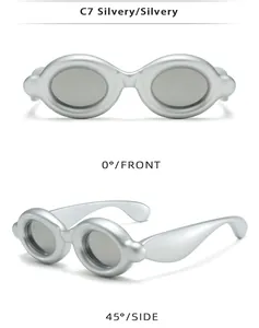 Detailed views of silver quirky frog-eye sunglasses from front and 45 degree side angles.