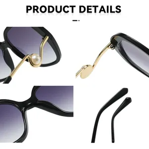 Detailansicht der Damen-Sonnenbrille mit perlenbesetzten gewellten goldenen Bügeln