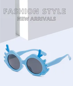 Close-up of cute blue cartoon dragon horn sunglasses for kids with UV protection feature