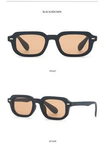 Vista detallada de gafas de sol cuadradas retro negras con lentes marrones y tachuelas