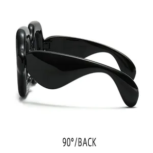 Detail view of chunky bubble square sunglasses in black showing 90-degree back angle
