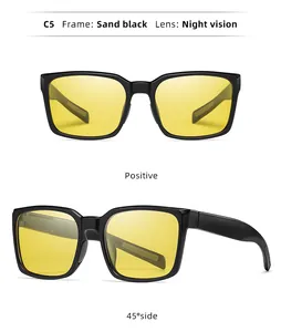 Sports cycling sunglasses with sand black frame and yellow night vision lenses shown at two angles